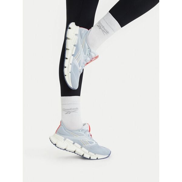 Buty do biegania Reebok. Niebieskie buty sportowe Reebok, bez wzorów, bez zapięcia, do biegania. Za 489,99 zł.