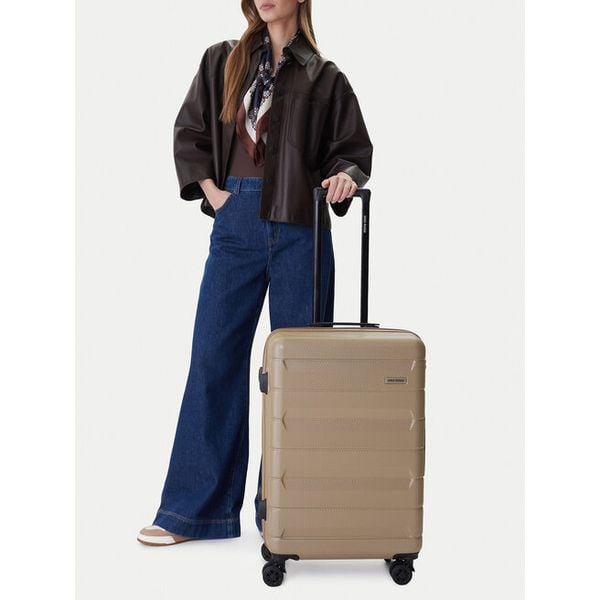 Walizka średnia GINO ROSSI. Brązowe walizki Gino Rossi, bez wzorów, średnie. Za 299,99 zł.