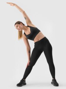4F Legginsy treningowe z materiału z recyklingu damskie - czarne XS. Czarne legginsy 4f, bez wzorów, z dzianiny. W wyprzedaży za 59,99 zł.