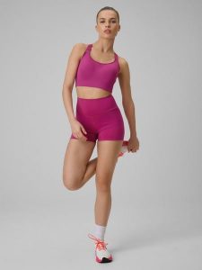 4F Legginsy krótkie treningowe damskie - różowe XS. Czerwone legginsy 4f, bez wzorów, z podwyższonym stanem, krótkie. Za 79,99 zł.