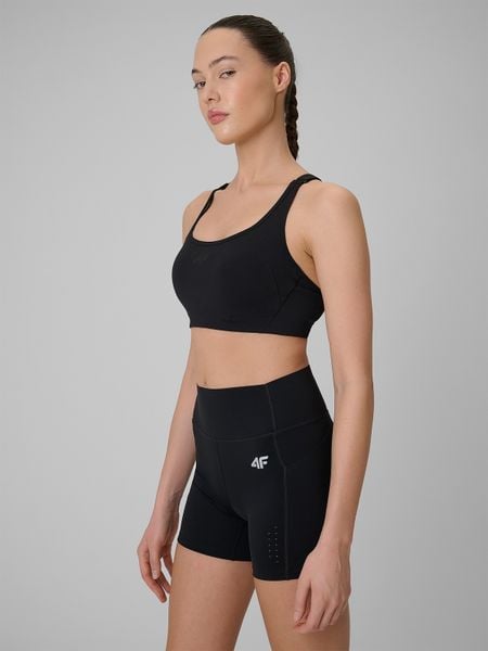 4F Biustonosz treningowy ze średnim wsparciem damski - czarny XL. Czarne biustonosze 4f, bez wzorów, z gumy. Za 129,99 zł.