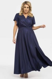 Sukienka połyskująca sylwestrowa maxi z rozporkiem kopertowy dekolt AKSENA granat. Sukienki KARKO, na studniówkę, l, bez wzorów, z elastanu, wizytowe, bez kołnierzyka, plus size, bez ramiączek, maxi, kopertowe. Za 289,50 zł.