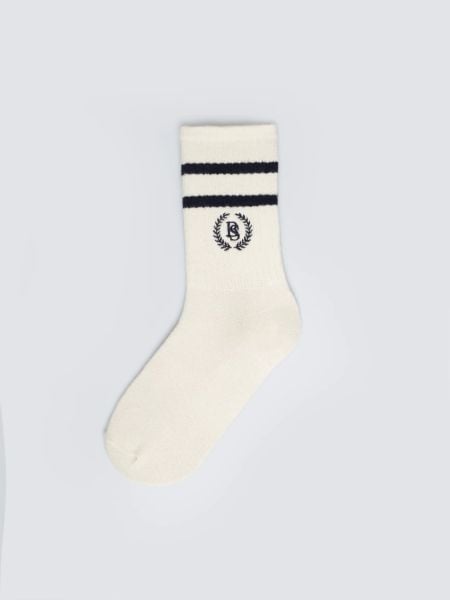 Skarpety damskie białe z granatowymi paskami Prepaliana 403. Niebieskie skarpetki Big Star, bez wzorów, z bawełny. Za 19,99 zł.