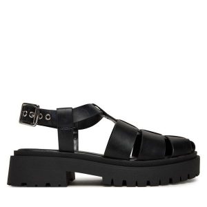 Sandały Steve Madden. Czarne sandały Steve Madden, bez wzorów, bez obcasa, na płaskiej podeszwie, bez zapięcia. Za 339,99 zł.