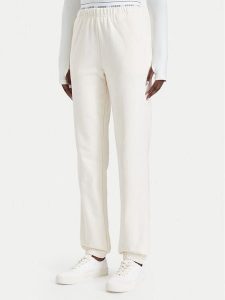 Guess Spodnie dresowe O5RB01 KCO31 Kremowy Regular Fit. Białe spodnie dresowe Guess, xl, z aplikacjami, z bawełny. Za 264,99 zł.