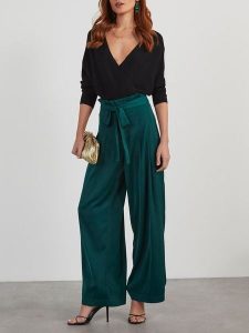 LA Angels Spodnie w kolorze zielonym rozmiar: S. Zielone spodnie z wysokim stanem LA Angels, bez wzorów, z materiału, z podwyższonym stanem. Za 173,99 zł.