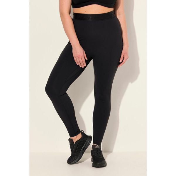 Damskie Legginsy sportowe LightFit kieszenie z recyklingu. Czarne legginsy Ulla Popken, bez wzorów, z elastanu. Za 244,99 zł.