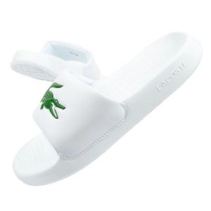 Klapki Lacoste Serve Slide W 02082 białe. Białe klapki bez wzorów, z syntetyku, bez obcasa. W wyprzedaży za 312,50 zł.