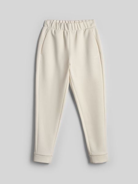 4F Spodnie dresowe joggery damskie - kremowe 3XL. Białe spodnie dresowe 4f, s, bez wzorów, z dresówki. Za 149,99 zł.
