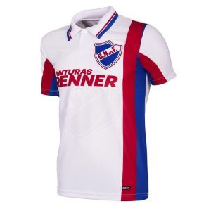Club Nacional de Football retro koszulka piłkarska z 1998 roku. Białe jeansy COPA FOOTBALL, bez wzorów, krótkie. Za 346,09 zł.