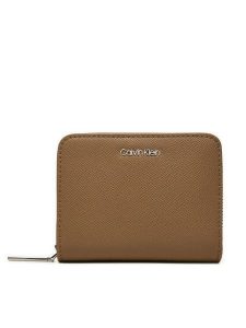 Calvin Klein Portfel Ck Must Md Zip Around_Caviar K60K612831 Beżowy. Brązowe portfele Calvin Klein, bez wzorów, ze skóry. Za 159,99 zł.