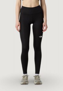 Legginsy Kobieta THE NORTH FACE W FLEX 28IN TIGHT. Czarne legginsy The North Face, bez wzorów, z elastanu, z podwyższonym stanem. Za 281,50 zł.