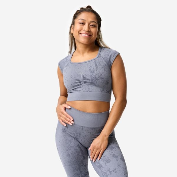 Koszulka fitness damska Domyos crop top seamless. Szare topy DOMYOS, xs, bez wzorów, z materiału, sportowe, bez kołnierzyka, bez ramiączek. Za 89,99 zł.