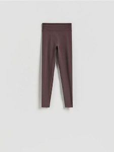 Gładkie legginsy - brązowy. Brązowe legginsy Reserved, bez wzorów, z dzianiny. Za 89,99 zł.