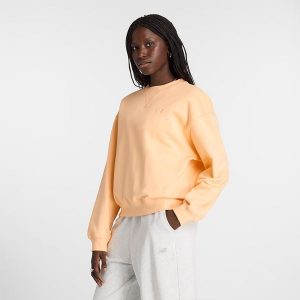 Bluza damska New Balance WT41500PAE – pomarańczowa. Brązowe bluzy New Balance, xl, bez wzorów, z bawełny, bez kaptura. Za 169,99 zł.