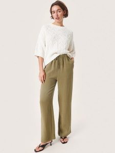 Soaked in Luxury Spodnie "Camile" w kolorze khaki rozmiar: XL. Brązowe spodnie z wysokim stanem Soaked in Luxury, bez wzorów, z materiału, z podwyższonym stanem. Za 175,45 zł.