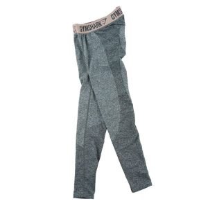 Second life - Legginsy damskie Gymshark Dri - Stan bardzo dobry. Szare legginsy Gymshark, bez wzorów, z materiału. Za 85,16 zł.