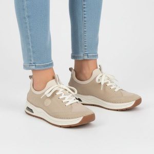 Półbuty damskie Rieker, cholewka ze skóry ekologicznej sportowa sylwetka wsuwane miękka amortyzowana podeszwa, beżowe, 44562-62. Brązowe półbuty Rieker, bez wzorów, ze skóry ekologicznej, bez obcasa, na płaskiej podeszwie, bez zapięcia. Za 369,00 zł.