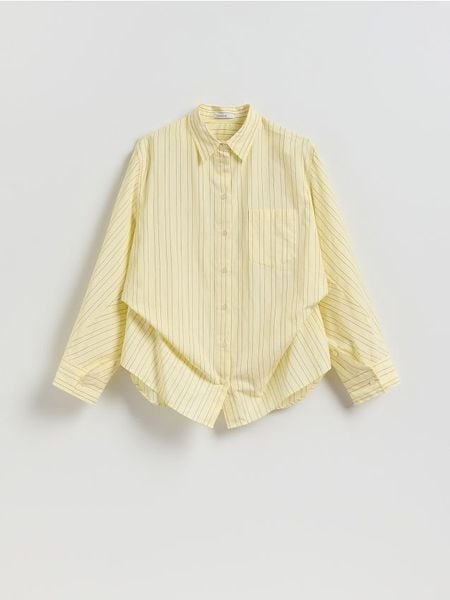 Bawełniana koszula w paski - jasnożółty. Żółte koszule Reserved, l, bez wzorów, z bawełny, bez kołnierzyka, bez ramiączek. Za 139,99 zł.