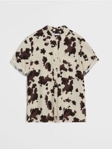 Wiskozowa koszula z ozdobnymi guzikami - wielobarwny. Koszule Sinsay, l, bez wzorów, z wiskozy, bez kołnierzyka, bez ramiączek. Za 25,99 zł.