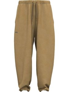 Under Armour Spodnie dresowe "Icon" w kolorze jasnobrązowym rozmiar: S. Brązowe spodnie dresowe Under Armour, s, bez wzorów, z bawełny. Za 188,40 zł.