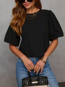 Milan Kiss Bluzka w kolorze czarnym rozmiar: M. Czarne bluzki Milan Kiss, m, bez wzorów, bez kołnierzyka, bez ramiączek. Za 131,74 zł.