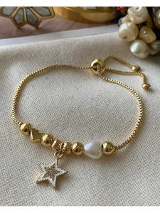 Luseera Pozłacana bransoletka z elementami ozdobnymi rozmiar: onesize. Żółte bransoletki Luseera, z cyrkonią, pozłacane. Za 39,99 zł.