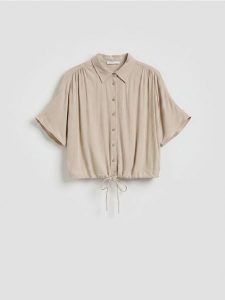 Wiskozowa koszula z wiązaniem - beżowy. Brązowe koszule Reserved, l, bez wzorów, z wiskozy, bez kołnierzyka, bez ramiączek. Za 79,99 zł.