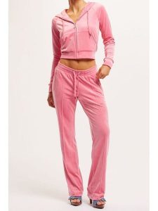 Juicy Couture Spodnie dresowe w kolorze jasnoróżowym rozmiar: M. Różowe spodnie dresowe Juicy Couture, m, bez wzorów, z dresówki. Za 146,28 zł.