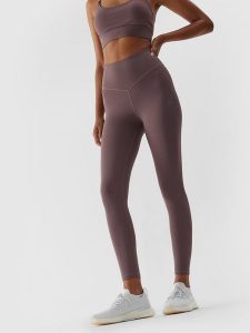 4F Legginsy sportowe w kolorze jasnobrązowym rozmiar: XL. Brązowe legginsy 4f, bez wzorów, z materiału, z podwyższonym stanem. Za 89,95 zł.
