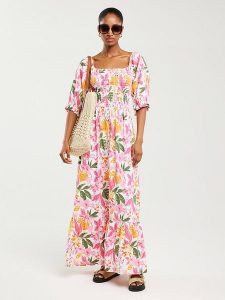 BIG STAR Sukienka "Dinova" w kolorze białym ze wzorem rozmiar: L. Białe sukienki Big Star, l, bez wzorów, z wiskozy, retro, bez kołnierzyka, bez ramiączek, maxi. Za 149,99 zł.