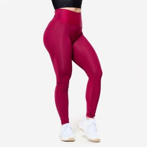Legginsy fitness damskie Domyos. Czerwone legginsy DOMYOS, bez wzorów, z materiału, z podwyższonym stanem. Za 99,99 zł.