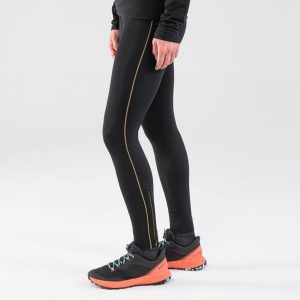 Legginsy do biegania w terenie damskie Kiprun Run 900. Czarne legginsy EVADICT, bez wzorów, z materiału, długie. Za 149,99 zł.