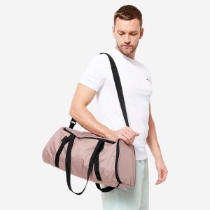 Torba fitness Domyos 20 l. Brązowe torby podróżne i sportowe DOMYOS, bez wzorów, z materiału, na ramię, średnie. Za 39,99 zł.