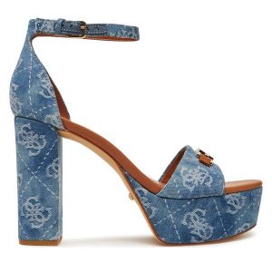 Sandały Guess. Niebieskie sandały Guess, z aplikacjami, bez obcasa, na słupku, bez zapięcia. Za 599,99 zł.