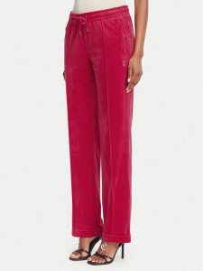 Juicy Couture Spodnie dresowe Tina JCAPW045 Czerwony Regular Fit. Czerwone spodnie dresowe Juicy Couture, m, bez wzorów, z dresówki. Za 399,99 zł.