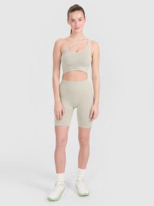 4F Legginsy kolarki bezszwowe treningowe damskie - beżowe XS/S. Brązowe legginsy 4f, bez wzorów. W wyprzedaży za 59,99 zł.