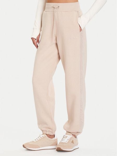 Guess Spodnie dresowe V5BB10 KB681 Beżowy Regular Fit. Brązowe spodnie dresowe Guess, xs, z aplikacjami, z bawełny. Za 199,99 zł.