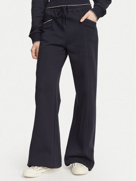 Guess Spodnie dresowe W6YB31 K5319 Granatowy Wide Leg. Niebieskie spodnie dresowe Guess, xs, z aplikacjami, z bawełny. Za 434,99 zł.