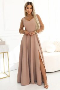 Długa suknia rozkloszowana z długim rękawem beżowa. Brązowe sukienki NUMOCO, na imprezę, l, bez wzorów, z elastanu, eleganckie, bez kołnierzyka, bez ramiączek, maxi, dopasowane. Za 449,00 zł.