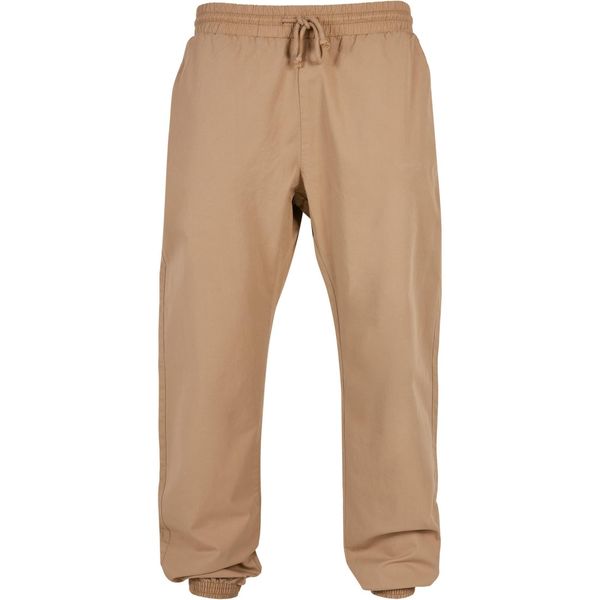 Damski strój do joggingu Urban Classics Basic. Brązowe spodnie dresowe Urban Classics, bez wzorów, z dresówki. Za 221,50 zł.