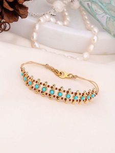 Charlize Pozłacana bransoletka z kamieniami szlachetnymi rozmiar: onesize. Brązowe bransoletki Charlize, z jaspisem, pozłacane. Za 117,73 zł.