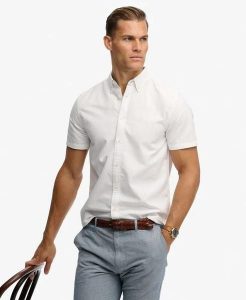 Superdry Koszula Preppy Oxford krótki rękaw z bawełny organicznej – OPTIC. Białe koszule Superdry, m, bez wzorów, z bawełny, bez kołnierzyka, bez ramiączek. Za 233,10 zł.