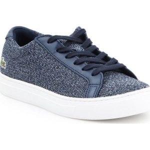 Buty lifestylowe Lacoste L 12 12 317 W 7-34CAW0017003 białe niebieskie. Białe trampki bez wzorów, z materiału, bez zapięcia. Za 544,84 zł.