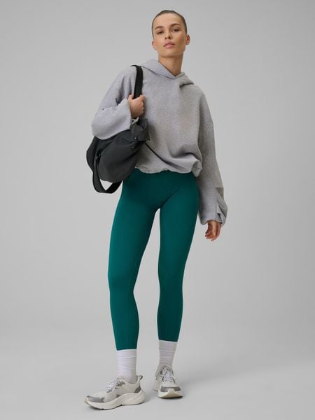 4F Legginsy treningowe bezszwowe damskie - turkusowe M/L. Niebieskie legginsy 4f, bez wzorów, z dzianiny, z podwyższonym stanem, długie. Za 119,99 zł.