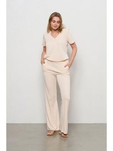 &Co Woman Spodnie "Maeve" w kolorze jasnoróżowym rozmiar: M. Różowe spodnie z wysokim stanem &Co Woman, bez wzorów, z materiału, z podwyższonym stanem. Za 123,82 zł.
