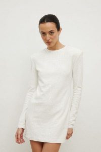 Sukienka z cekinami w kolorze CREM- CONFETTI. Sukienki Marsala, na imprezę, l, bez wzorów, z elastanu, eleganckie, bez kołnierzyka, bez ramiączek, mini, dopasowane. Za 339,90 zł.