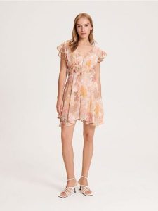 Wzorzysty kombinezon - wielobarwny. Kombinezony Reserved, l, bez wzorów, z tkaniny, bez kołnierzyka, bez ramiączek. W wyprzedaży za 49,99 zł.