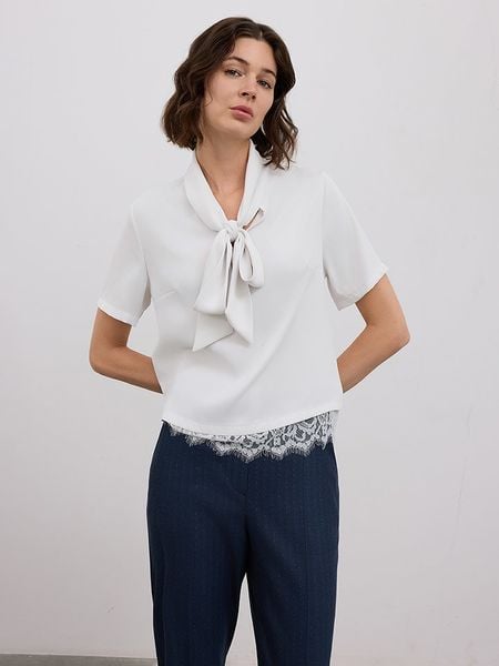 BGN Bluzka w kolorze białym rozmiar: 40. Białe bluzki BGN, bez wzorów, z koronki, bez kołnierzyka, bez ramiączek. Za 122,38 zł.