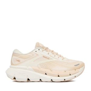 Buty do biegania Reebok. Brązowe buty sportowe Reebok, bez wzorów, bez zapięcia, do biegania. Za 455,99 zł.